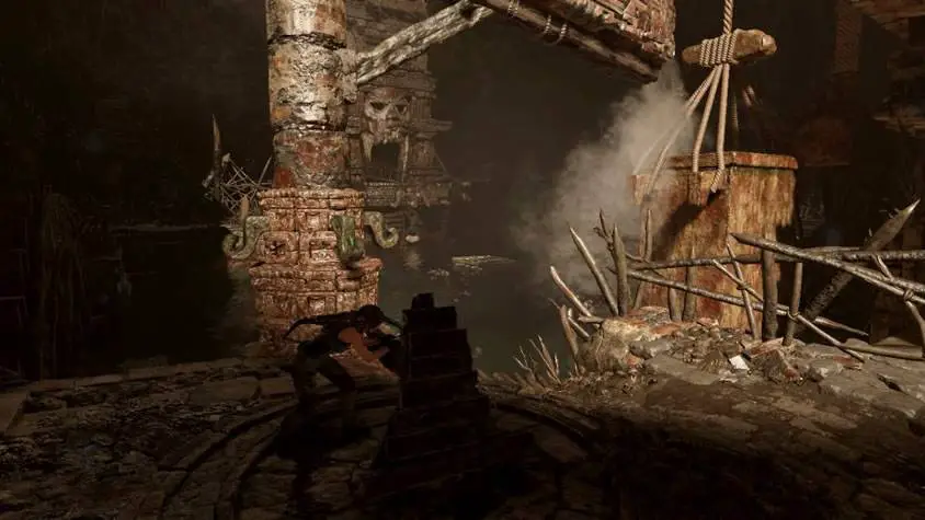 Lara operando máquina de jorrar água em Shadow of the Tomb Raider